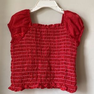 3 for $8; Cute Girls red smocked top with embroidery sleeves.